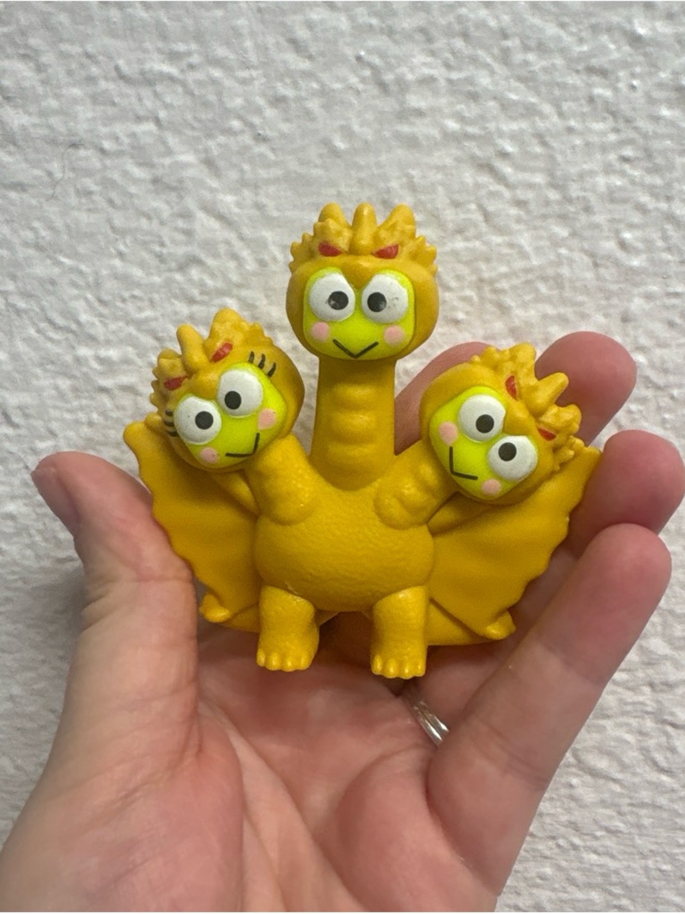 Yellow Three-Headed Sanrio figure